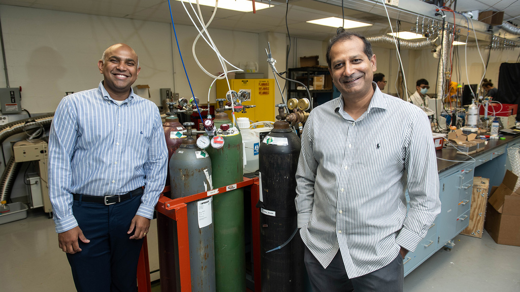 Syed Mubeen and Suresh Raghavan pose for a photo in the lab